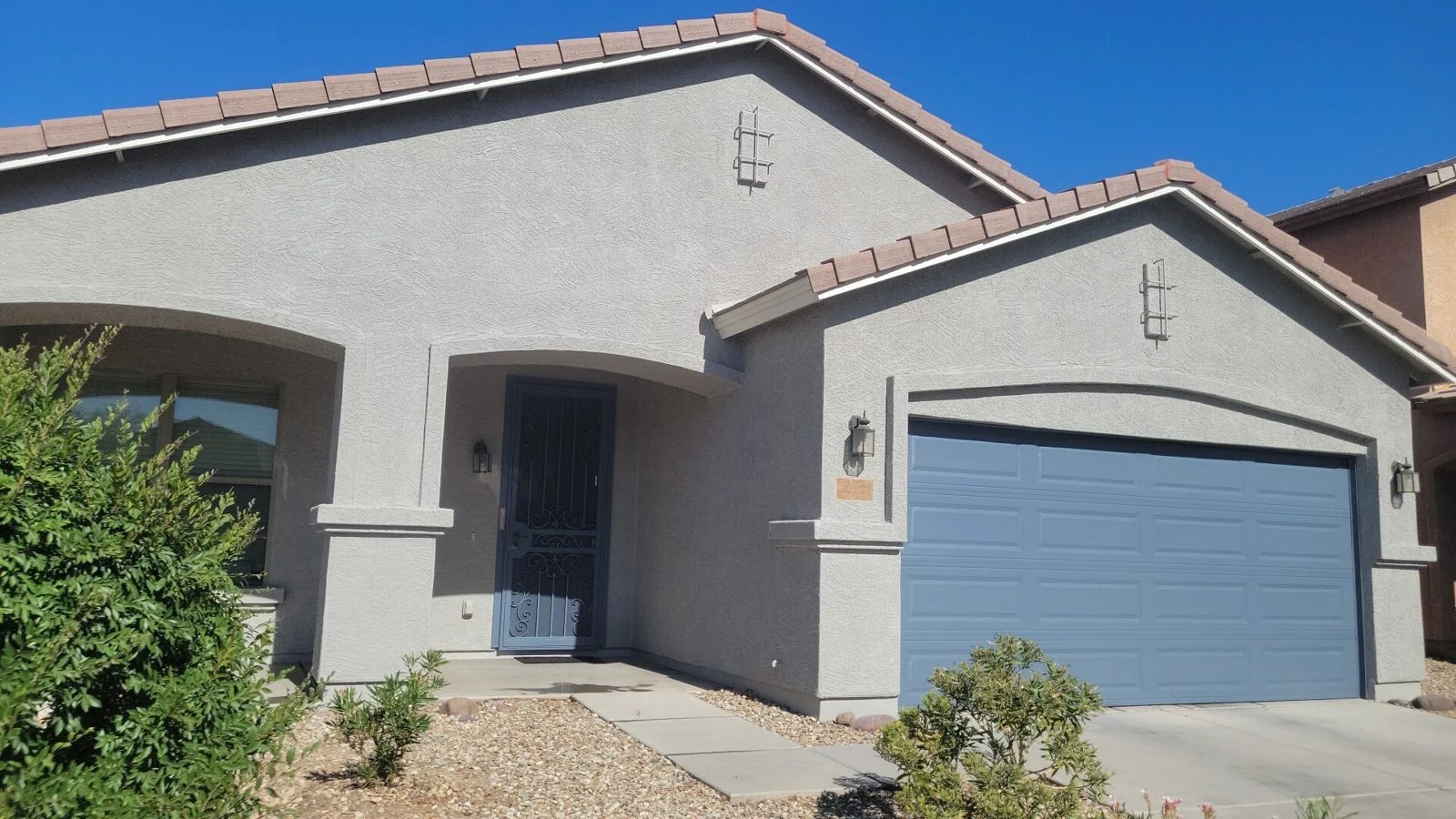 Residential painting in Peoria AZ on a stucco home exterior