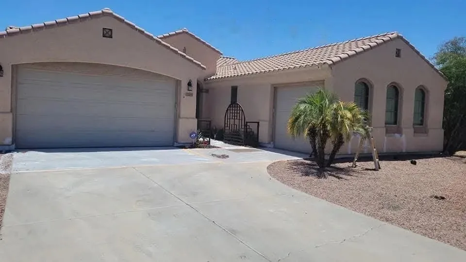 Peoria, Arizona home exterior before repainting, with faded tan stucco and worn trim